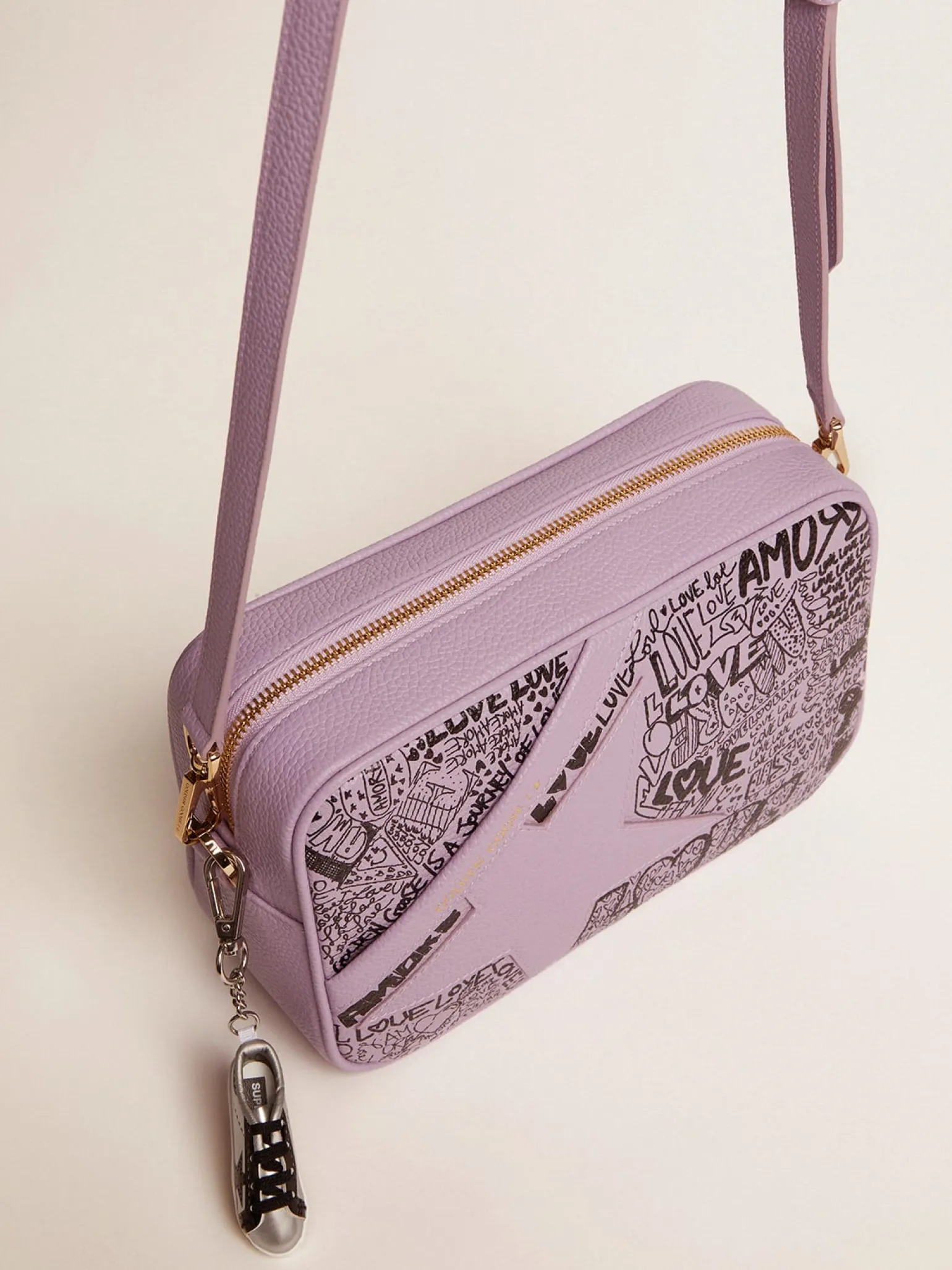 Clearance Bolsa Star de couro martelado lilás com estrela de couro tom sobre tom e estampa de grafite preto all-over MULHER Bolsas tiracolo