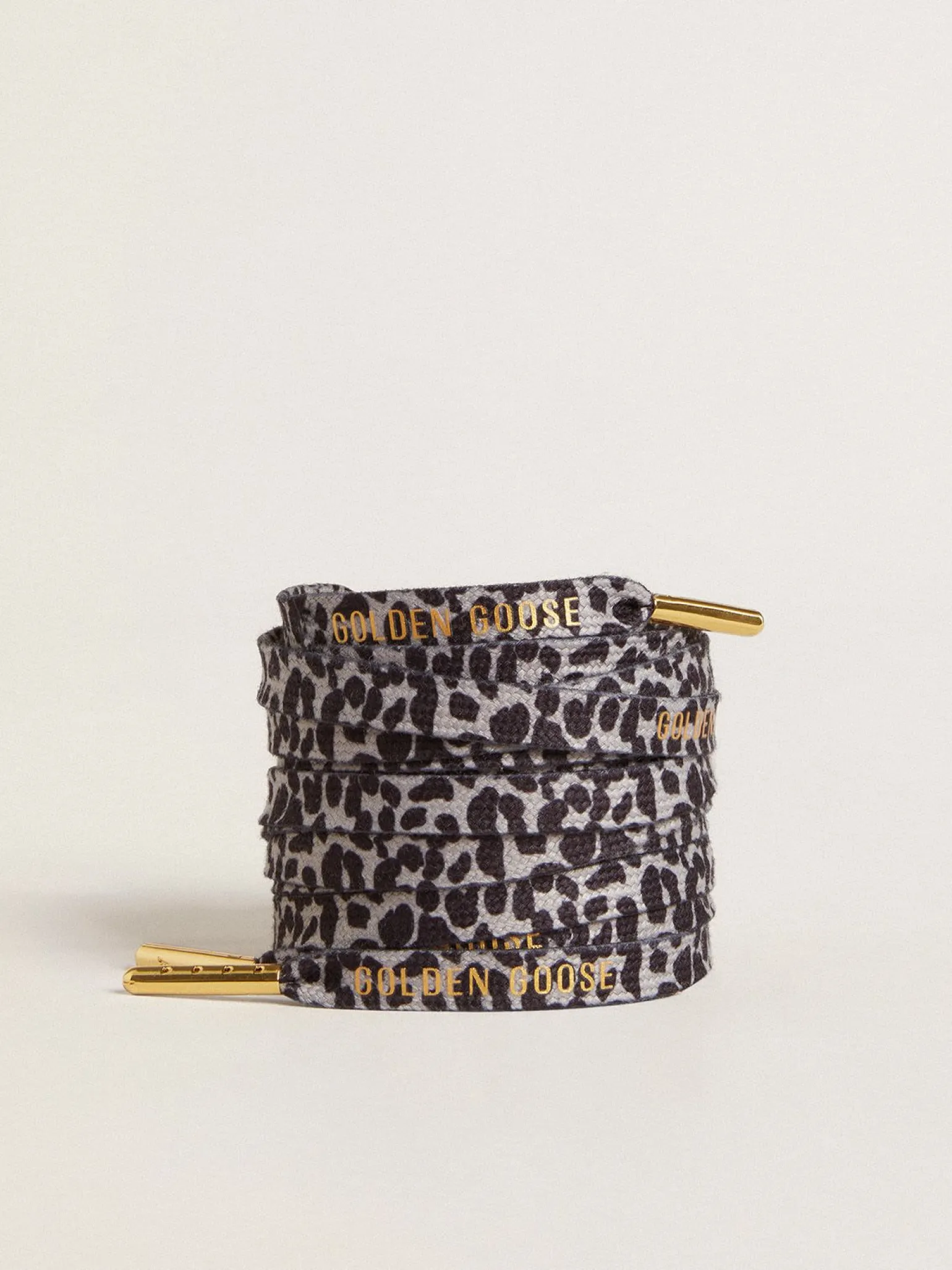 Fashion Cadarços salpicados em branco e preto com logo dourado em contraste MULHER Cadarços|Cadarços